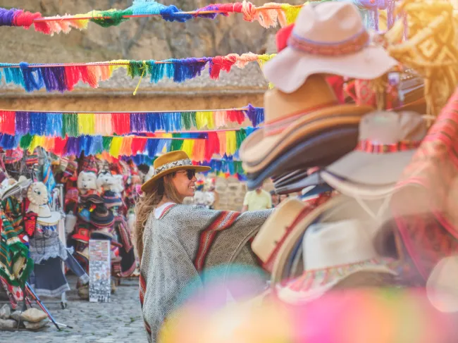 female traveler shopping in colorful Peruvian market